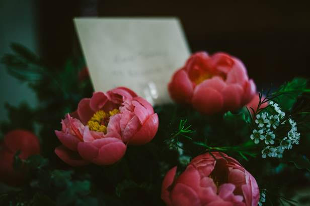 Flowers and a written note at funeral