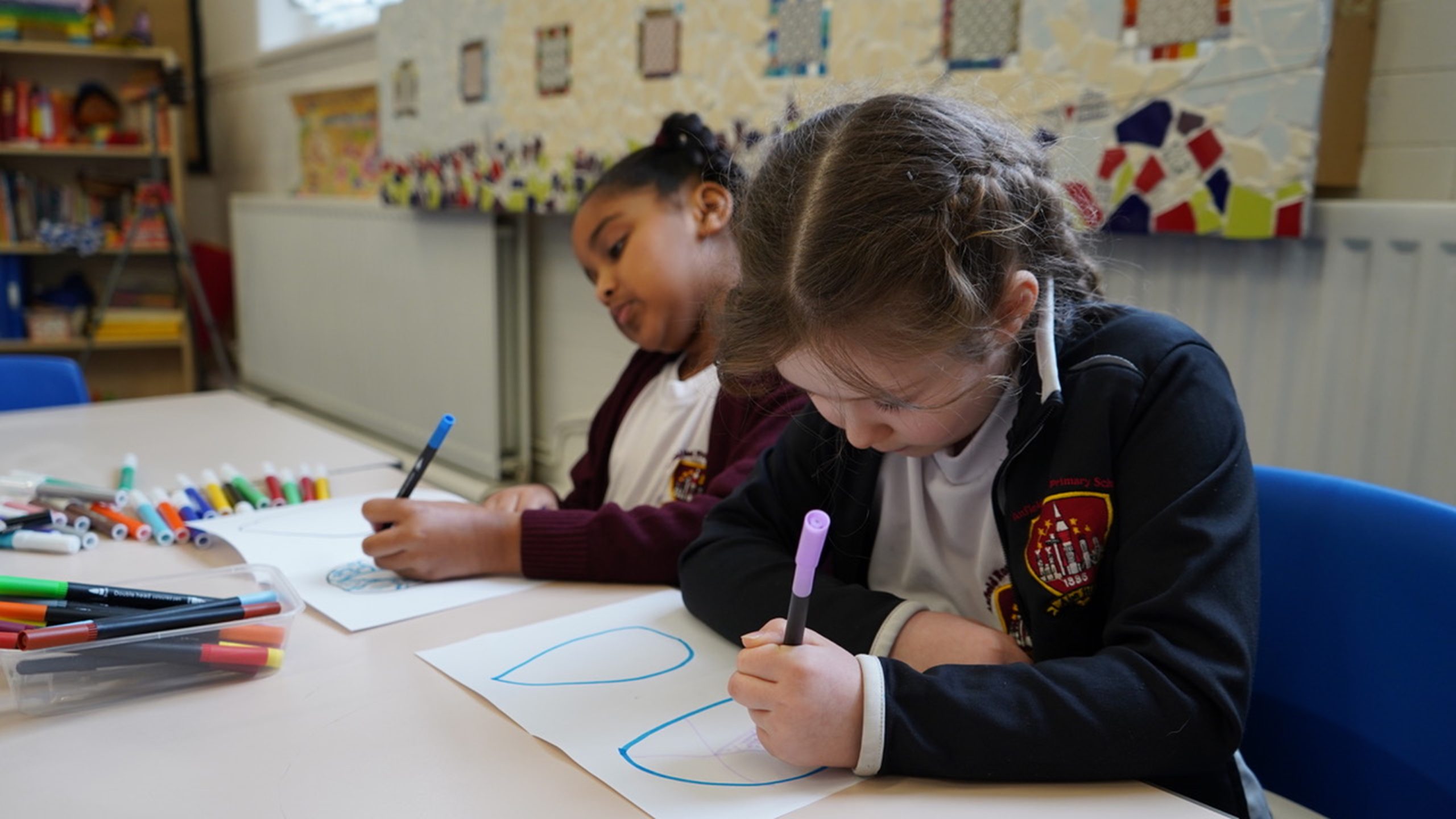 Children drawing in a classroom