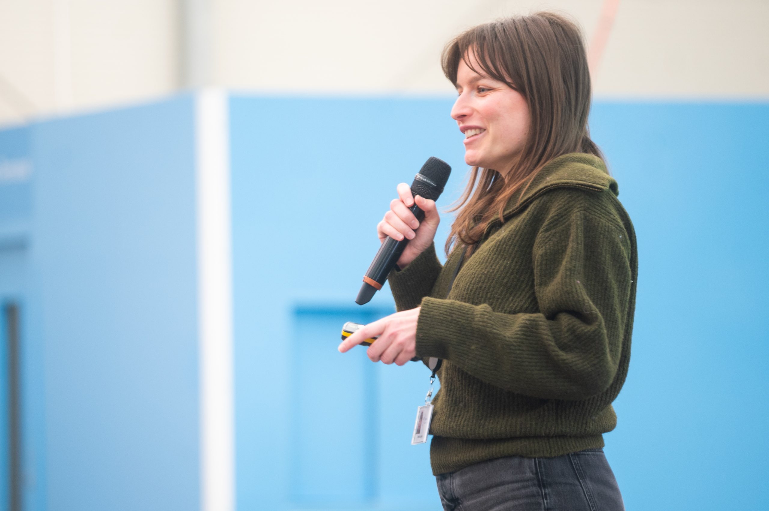 Woman talking into a microphone