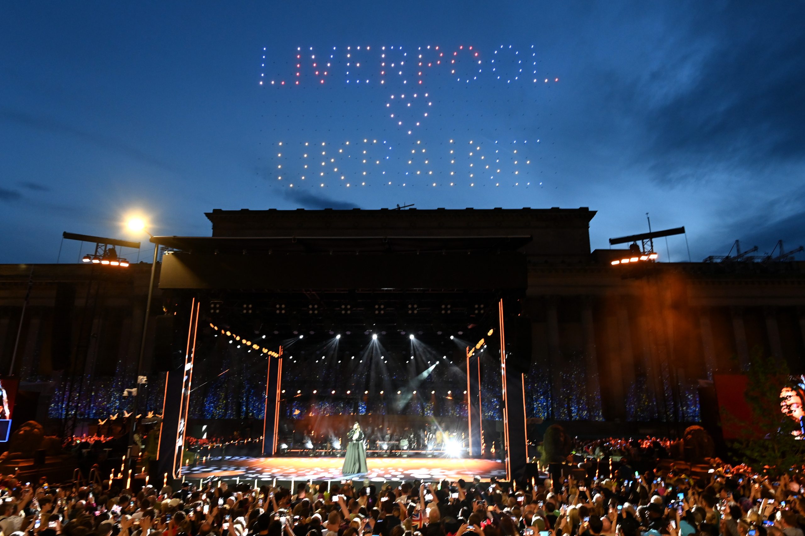 Image of Big Eurovision Welcome event features stage in front of St George's Hall witht he words Liverpool and Ukraine in the sky. Photo courtesy of Getty Images