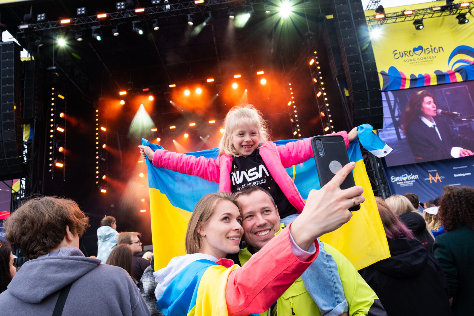 Image of a family taking a selfie at Liverpool's Eurovision Village