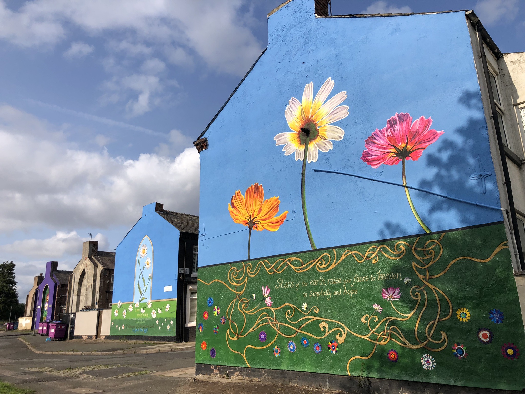 Flower mural on gable end of a house