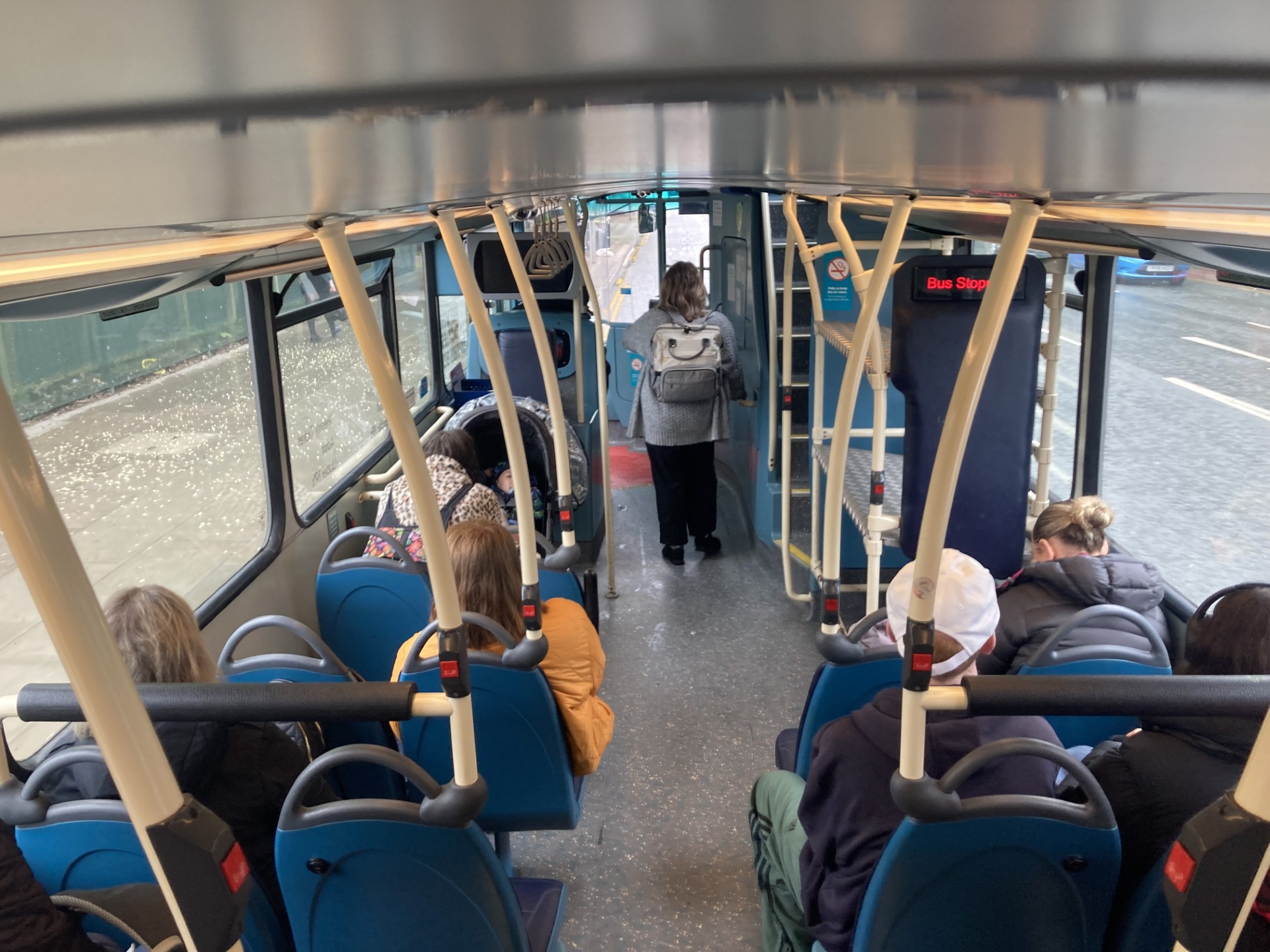 People sat and stood on a bus