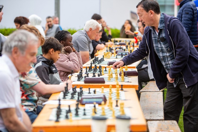 A number of people playing chess