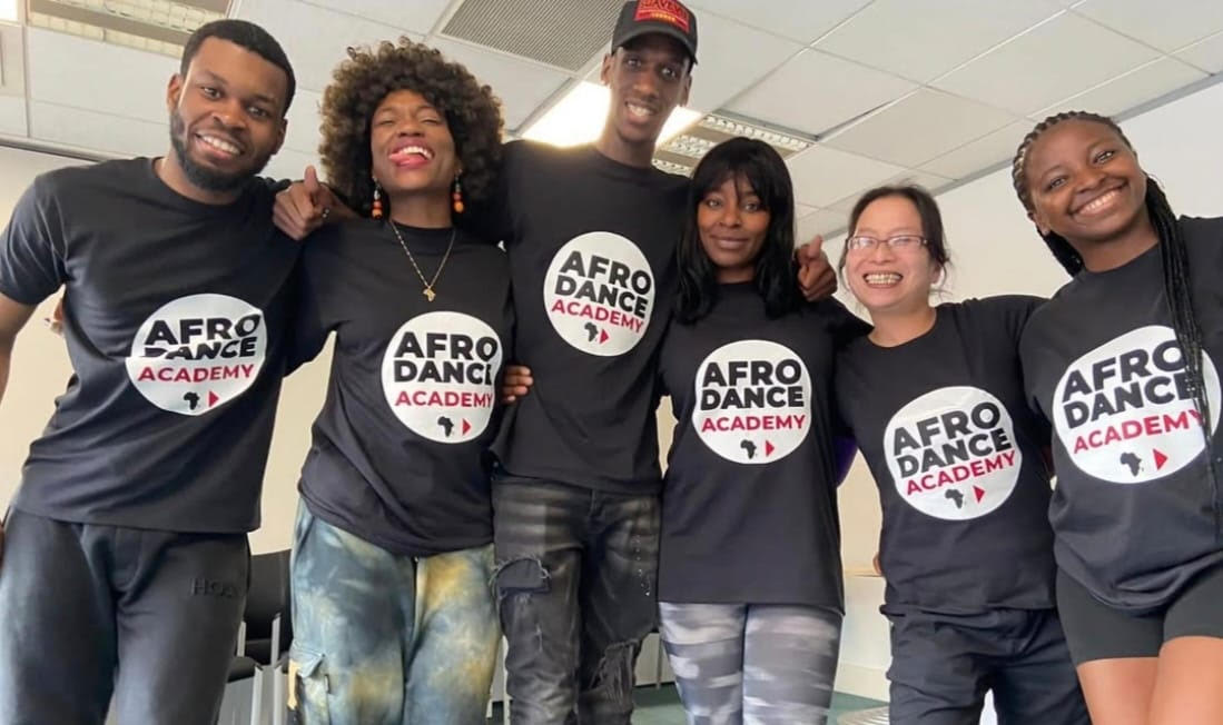 Group of people wearing Afro Dance Academy t-shirts