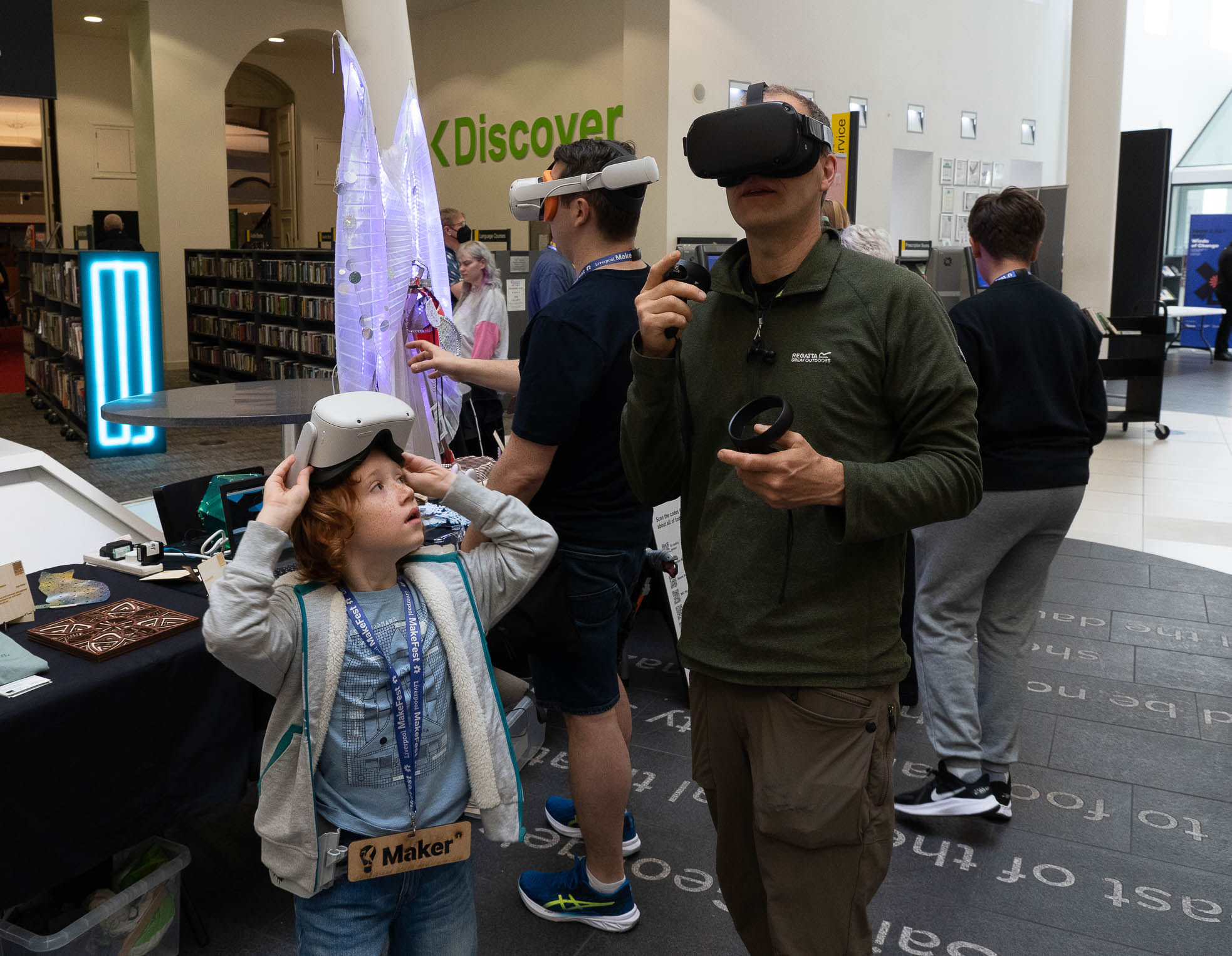 Father and son enjoy another world thanks to some virtual reality masks