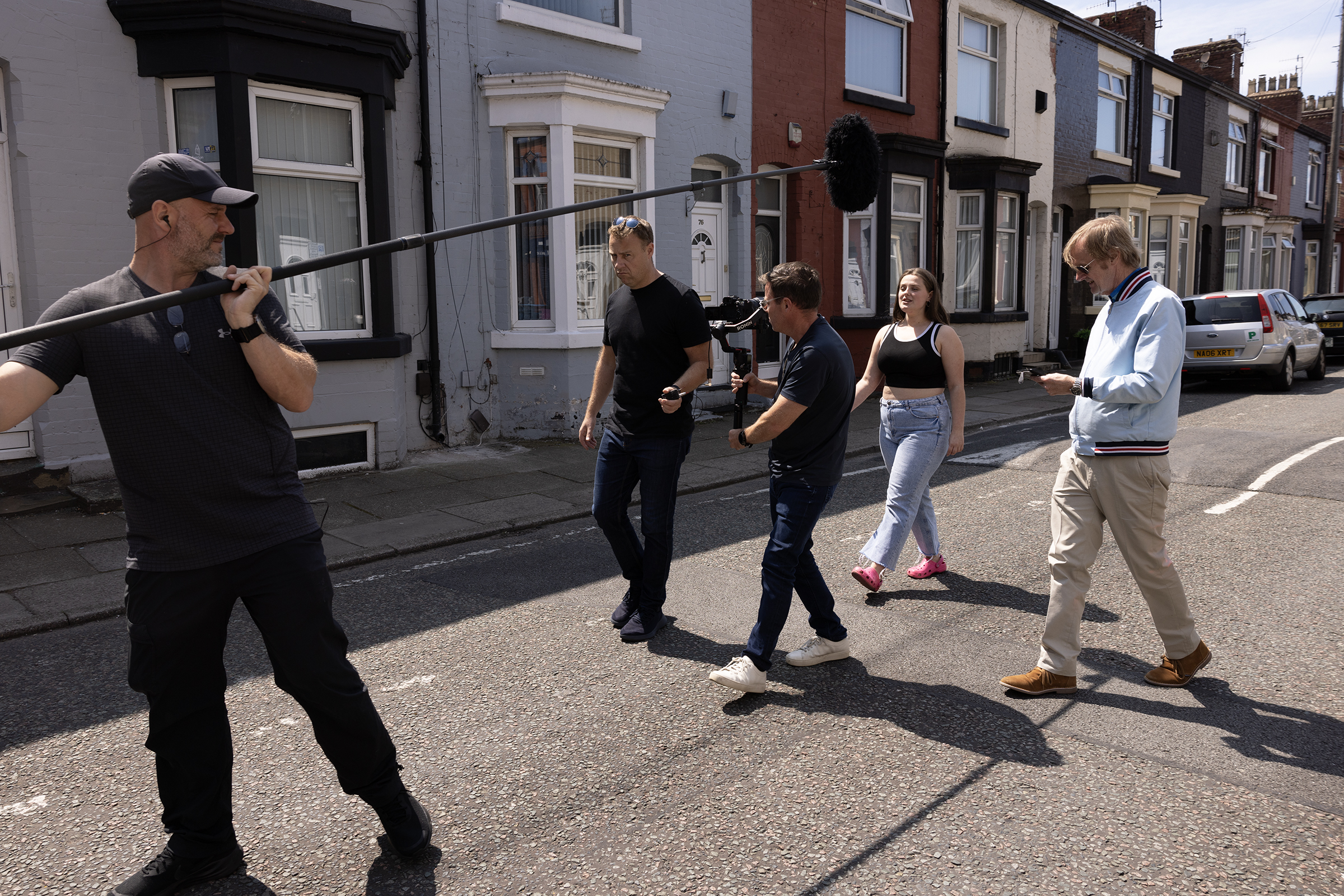 Camera crew filming on the street